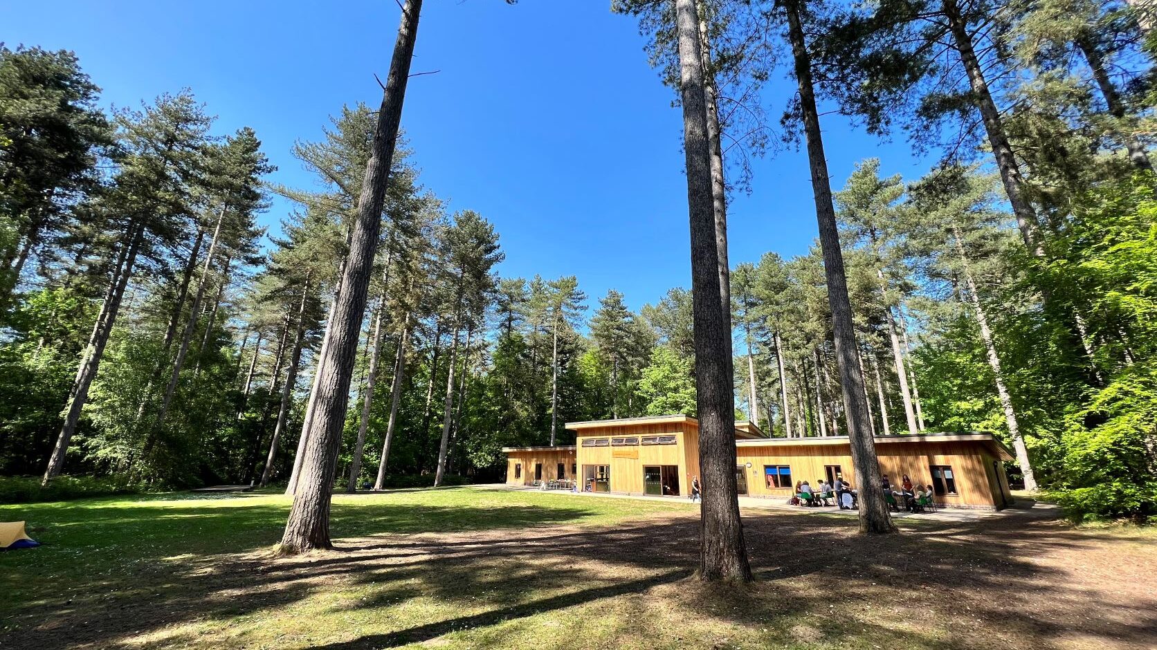 Thorpe Woodlands activity centre under blue skies and nestled amongst the trees